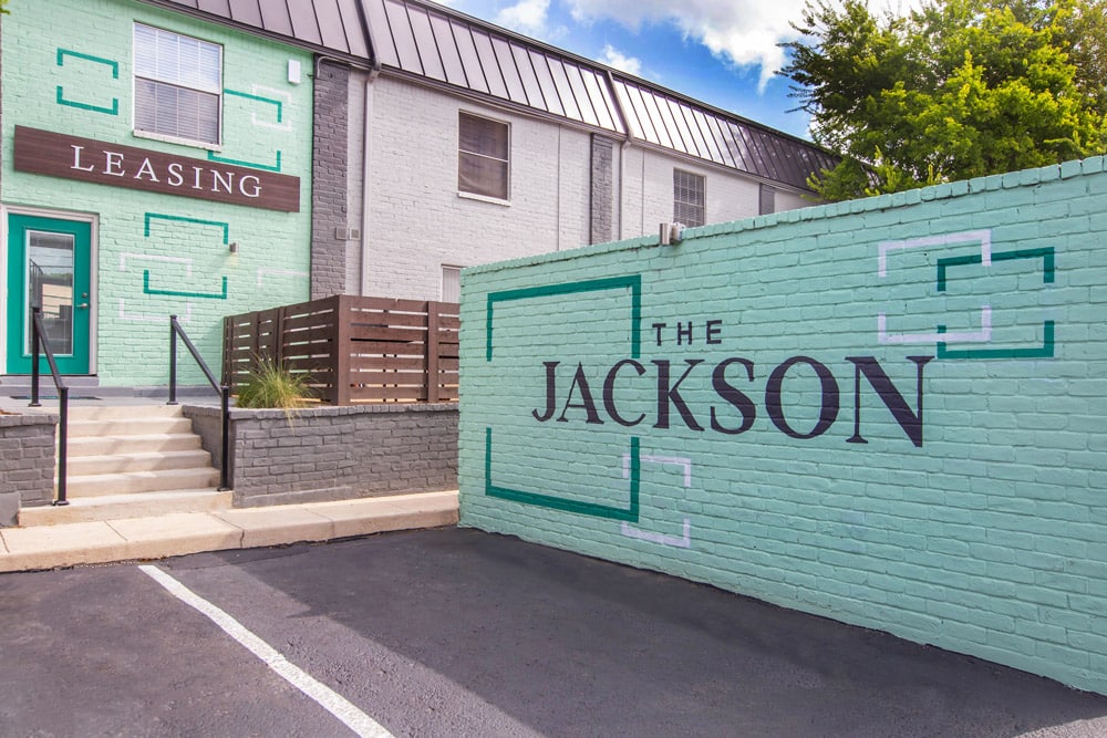 The exterior and entrance of The Jackson leasing office.